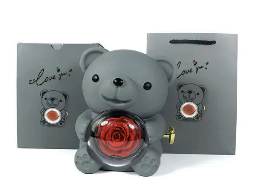 Gift box with rotating bear and box of roses 
