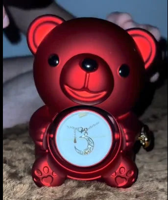 Gift box with rotating bear and box of roses 